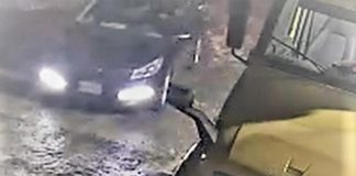 Peterborough police have released photos of a four-door blue sedan suspected in the theft of a tractor trailer carrying more than 2,000 firearms on February 13, 2022. (Police-supplied photo)