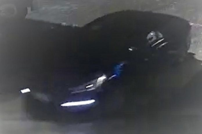 Peterborough police have released photos of a four-door blue sedan suspected in the theft of a tractor trailer carrying more than 2,000 firearms on February 13, 2022. (Police-supplied photo)