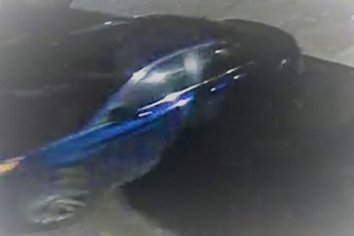 Peterborough police have released photos of a four-door blue sedan suspected in the theft of a tractor trailer carrying more than 2,000 firearms on February 13, 2022. (Police-supplied photo)