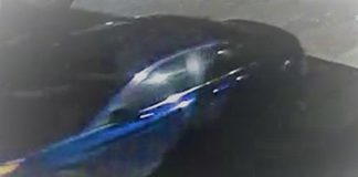 Peterborough police are continuing their investigation into the February 13, 2022 theft of a tractor trailer carrying over 2,000 firearms. The trailer was recovered, but 13 firearms are missing. Police believe the suspects in the theft were driving this four-door blue sedan. (Police-supplied photo)