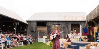 Kate Suhr performs, with Megan Murphy (right) and Saskia Tomkins in the background, during a performance of "The Verandah Society" at 4th Line Theatre in Millbrook in summer 2021. Four songs from the production are now available as a digital EP. (Photo: Tristan Peirce Photography)