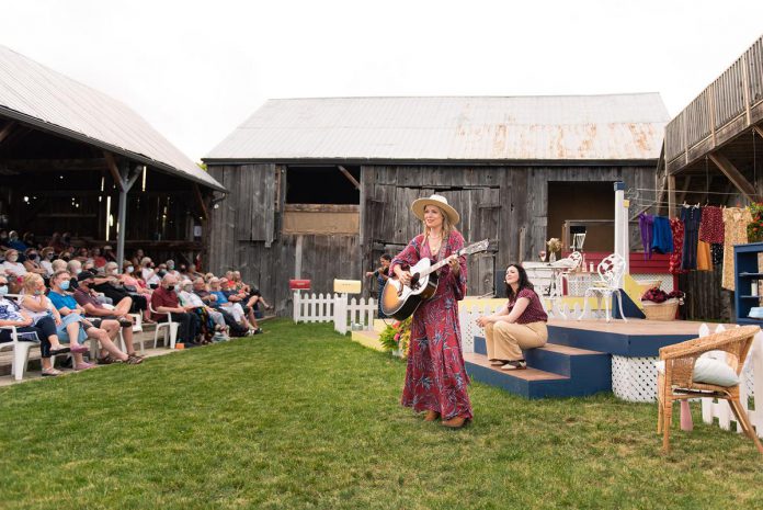 Kate Suhr performs, with Megan Murphy (right) and Saskia Tomkins in the background, during a performance of "The Verandah Society" at 4th Line Theatre in Millbrook in summer 2021. Four songs from the production are now available as a digital EP. (Photo: Tristan Peirce Photography)