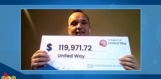 On behalf of 27 United Way locations across Ontario, United Way Greater Toronto president and CEO Daniele Zanotti accepts a donation of almost $120,000 from OLG during a virtual cheque presentation. (kawarthaNOW screenshot)