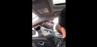 Peterborough police smashed a vehicle window to arrest local anti-lockdown and anti-vaccine mandate advocate Tyler Berry on February 26, 2022. (kawarthaNOW screenshot of Facebook video)