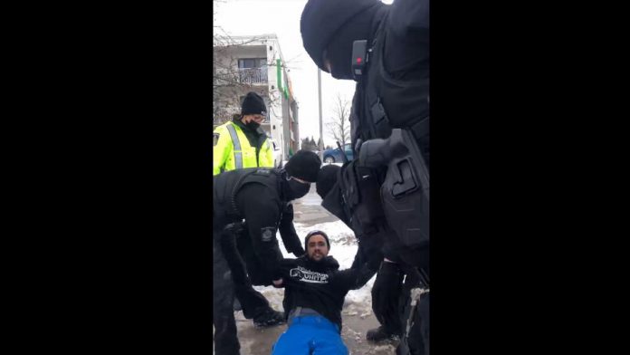 Tyler Berry's girlfriend recorded him being dragged away by police when police arrested Berry on the strength of a warrant on February 26, 2022, after smashing a vehicle window to gain access to the vehicle. (kawarthaNOW screenshot of Facebook video)