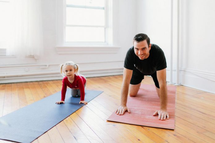 Mike Dalliday, pictured with his daughter Rachel, has stepped away from his health care career to become the CEO of his late wife's successful business Pilates on Demand, launching a completely redesigned website with upgraded features for members. (Photo courtesy of Mike Dalliday)