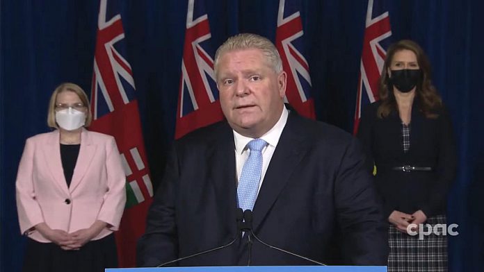 Ontario Premier Doug Ford declares a state of emergency, in response to protestors occupying the city of Ottawa and blockading the border crossing in Windsor, at a media conference at Queen's Park in Toronto on February 11, 2022. (kawarthaNOW screenshot of CPAC video)