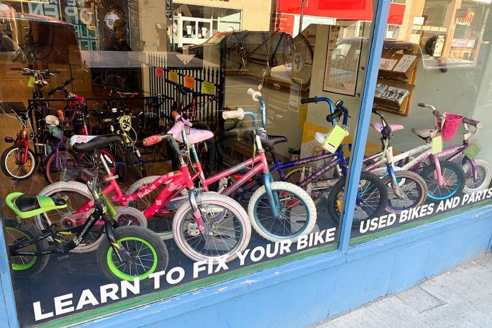 During "Kids' Bike Build", B!KE: the Peterborough Community Bike Shop refurbishes donated bikes and provides them free of charge to local organizations working with children and youth. (Photo: B!KE)