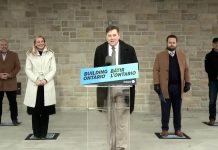 Brighton mayor Brian Ostrander at the podium along with (from left) Ontario energy minister Todd Smith, infrastructure minister Kinga Surma, Northumberland—Peterborough South MPP David Piccini, and Hydro One CEO David Lebeter during an announcement on March 25, 2022 of a pilot project with Hydro One to bring high-speed internet access to Brighton. (Screenshot: kawarthaNOW)