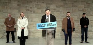Brighton mayor Brian Ostrander at the podium along with (from left) Ontario energy minister Todd Smith, infrastructure minister Kinga Surma, Northumberland—Peterborough South MPP David Piccini, and Hydro One CEO David Lebeter during an announcement on March 25, 2022 of a pilot project with Hydro One to bring high-speed internet access to Brighton. (Screenshot: kawarthaNOW)
