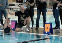 Carl Oake, who founded the Carl Oake Rotary Swim in 1987, congratulating his daughter Renee Oake after she completed 156 lengths at the 36th annual swim on February 25, 2022, which has raised over $50,000 in support of the Rotary Club of Peterborough projects and Easter Seals. (Photo: Rotary Club of Peterborough / Facebook)