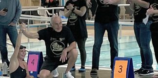 Carl Oake, who founded the Carl Oake Rotary Swim in 1987, congratulating his daughter Renee Oake after she completed 156 lengths at the 36th annual swim on February 25, 2022, which has raised over $50,000 in support of the Rotary Club of Peterborough projects and Easter Seals. (Photo: Rotary Club of Peterborough / Facebook)