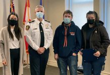 Laura Blake, Shawn Torrison, and Hilary Caird (pictured with Cobourg police chief Paul VandeGraaf) worked together to pull a woman from Lake Ontario on Boxing Day. (Photo: Cobourg Police Service)