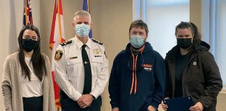 Laura Blake, Shawn Torrison, and Hilary Caird (pictured with Cobourg police chief Paul VandeGraaf) worked together to pull a woman from Lake Ontario on Boxing Day. (Photo: Cobourg Police Service)