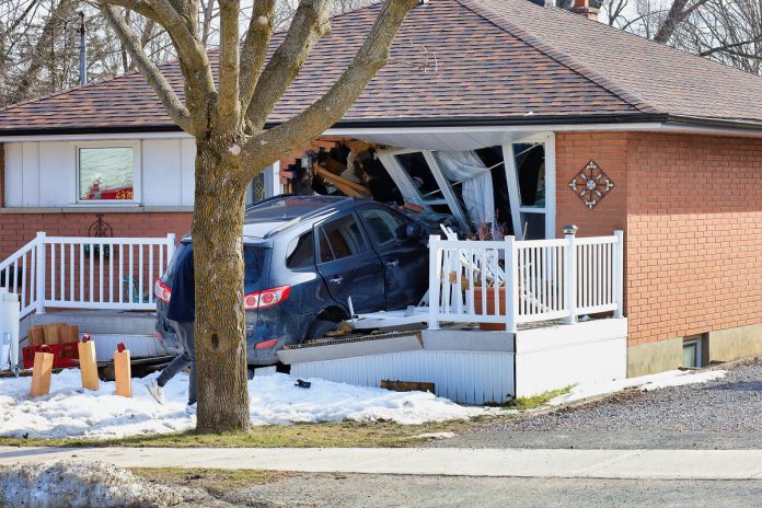 A home on Fairbairn Street was extensively damaged after a car drove into it following a collision with a taxi van on March 21, 2022. (Photo: Brian Papypra)