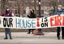 Climate activists hold a banner during the Global Climate Strike event at Confederation Square in downtown Peterborough on March 25, 2022. The event, part of the global Fridays for Futures movement, was led by the Youth Climate Action Club of Peterborough-Nogojiwanong. (Photo: Sean Bruce)