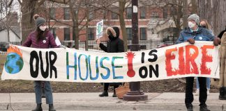 Climate activists hold a banner during the Global Climate Strike event at Confederation Square in downtown Peterborough on March 25, 2022. The event, part of the global Fridays for Futures movement, was led by the Youth Climate Action Club of Peterborough-Nogojiwanong. (Photo: Sean Bruce)