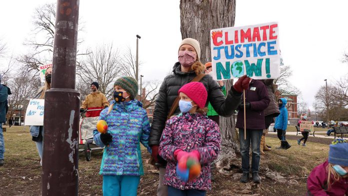 A family attends the Global Climate Strike event at Confederation Square in downtown Peterborough on March 25, 2022. (Photo: Sean Bruce)