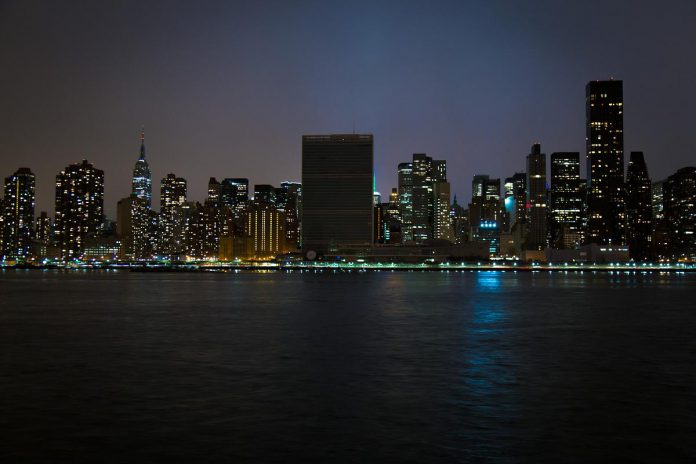 While lights remained on in other buildings, the United Nation Headquarters complex in New York went dark for Earth Hour in 2015. Transformational environmental awareness and legislative change start with individual actions as part of movements like Earth Hour. (Photo: John Gillespie)