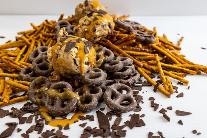 Sweet and salty lovers, rejoice! New for 2022, Peanut Butter Pretzel is a peanut butter ice cream with a chocolate ripple, white chocolate pretzel bark, and dark chocolate flakes. (Photo: Central Smith Creamery)