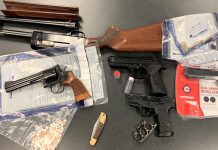 Kawartha Lakes police seized these weapons and drugs afte executing a search warrant at a residence on St. Paul Street in Lindsay on March 24, 2022. (Police-supplied photo)