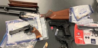 Kawartha Lakes police seized these weapons and drugs afte executing a search warrant at a residence on St. Paul Street in Lindsay on March 24, 2022. (Police-supplied photo)