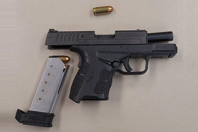 Police discovered a loaded handgun in a vehicle that crashed into a concrete barrier on on Highway 401 west in the Cobourg area on February 28, 2022. A 32-year-old Scarborough man is facing multiple firearms and other charges. (Police-supplied photo)