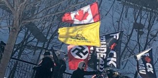A Nazi flag at the truckers protest in Ottawa in January 2022. According to Statistics Canada, hate targeting the Black and Jewish populations remained the most common types reported by police across Canada in 2020. (Photo: Centre for Israel and Jewish Affairs / Twitter)