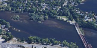 Peterborough city council has rejected a proposal to protect a corridor for a possible future two-lane bridge over the Otonabee River connecting Sherbrooke Street in downtown Peterborough to Maria Street in East City. The Eastside Transportation Study also recommended widening Maria Street to four lanes (including the swing bridge) and extending Maria Street to Television Road. (kawarthaNOW modification of Google Maps photo)