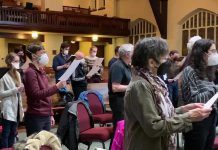 Some of the members of the Peterborough Singers singing the national anthem of Ukraine during a choir rehearsal on March 8, 2022. (kawarthaNOW screenshot of YouTube video)