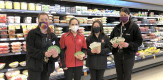 Lori Naoum and Sarah Winter (far left and far right) of Sobeys in Fenelon Falls presenting Miya Bradburn and Amy Balsdon of The Salvation Army with more than $13,000 worth of Sobeys gift cards for the local food bank. (Photo courtesy of The Salvation Army Fenelon Falls)
