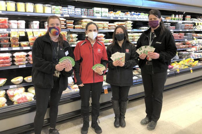 Lori Naoum and Sarah Winter (far left and far right) of Sobeys in Fenelon Falls presenting Miya Bradburn and Amy Balsdon of The Salvation Army with more than $13,000 worth of Sobeys gift cards for the local food bank. (Photo courtesy of The Salvation Army Fenelon Falls)