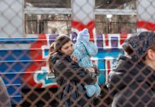 A Ukrainian family in Przemysl, Poland on February 27, 2022 after fleeing Russian aggression in Ukraine. (Photo: Mirek Pruchnicki)