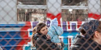 A Ukrainian family in Przemysl, Poland on February 27, 2022 after fleeing Russian aggression in Ukraine. (Photo: Mirek Pruchnicki)