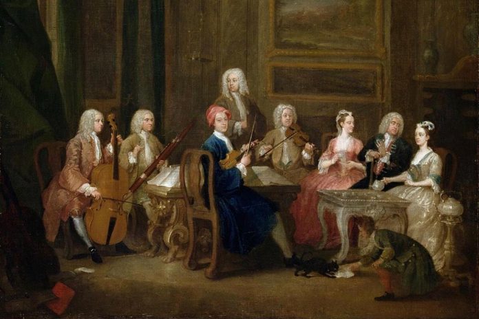 A dual-reed instrument, the bassoon dates back to the early 17th century. A bassoonist (second from left) prepares to play in "A Musical Party, The Mathias Family", by English painter William Hogarth (1730).