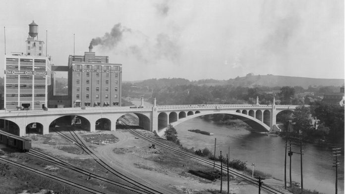 After an explosion and fire destroyed the Quaker Oats plant in 1916, the company rebuilt on the condition  the city construct an improved Hunter Street Bridge.  (Photo courtesy of City of Peterborough)