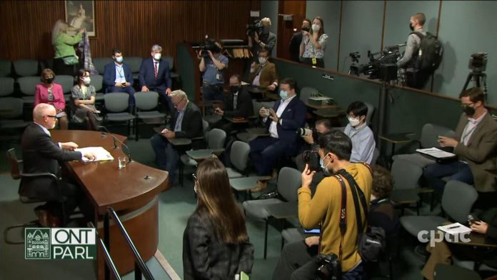 Ontario's chief medical officer of health Dr. Kieran Moore (left) at a media briefing at Queen's Park on April 11, 2022. (kawarthaNOW screenshot of CPAC video)