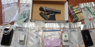 A loaded handgun, ammunition, fentanyl, crack cocaine, hydromorphone, scales, cell phones. and Canadian currency seized by police at a Peterborough residents on April 7, 2022 as part of a drug investigation by the OPP's Peterborough/Northumberland Community Street Crime Unit. (OPP-supplied photo)