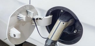 An electric vehicle being charged. (Stock photo)