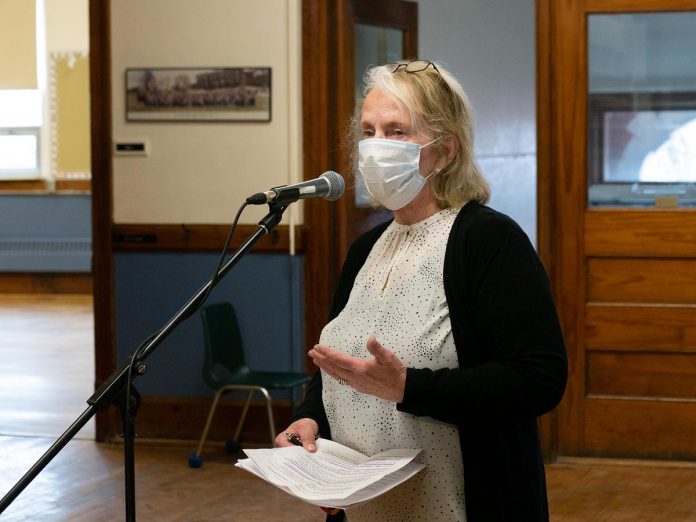 Diane Lloyd, chair of the Kawartha Pine Ridge District School Board, speaks during the April 14, 2022 launch event for Public Energy Performing Arts' 'Erring at King George' multidisciplinary arts festival, which runs from May 6 to 8 and 13 to 15. Public Energy approached the school board four years ago to see if the decommissioned King George Public School in Peterborough's East City could be made available for a performance and visual art festival. (Photo: Andy Carroll)