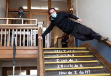 At a launch event on April 14, 2022, Wes Ryan of the Peterborough Academy of Circus Arts performs "No Elevator to Success" in a stairwell of Peterborough's decommissioned King George Public School, the site of Public Energy Performing Arts' 'Erring at King George' multidisciplinary arts festival running from May 6 to 8 and 13 to 15. (Photo: Andy Carroll)