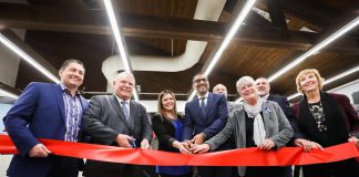 Ontario premier Doug Ford (second from left), Fleming College president Maureen Adamason (third from right), and Haliburton-Kawartha Lakes-Brock MPP Laurie Scott (far right) were among the dignitaries at Fleming College's Frost Campus in Lindsay cutting a ceremonial ribbon at the Shakir Rehmatullah Atrium, named in recognition of the founder and president of FLATO Developments Inc. (fourth from left) which has donated $1.2 million to the college for a capital innovation fund and a scholarship program. (Photo: Office of the Premier)