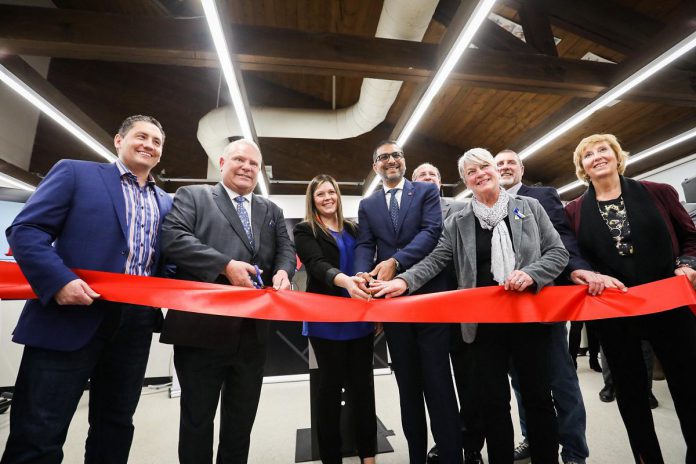 Ontario premier Doug Ford (second from left), Fleming College president Maureen Adamason (third from right), and Haliburton-Kawartha Lakes-Brock MPP Laurie Scott (far right) were among the dignitaries at Fleming College's Frost Campus in Lindsay cutting a ceremonial ribbon at the Shakir Rehmatullah Atrium, named in recognition of the founder and president of FLATO Developments Inc. (fourth from left) which has donated $1.2 million to the college for a capital innovation fund and a scholarship program. (Photo: Office of the Premier)
