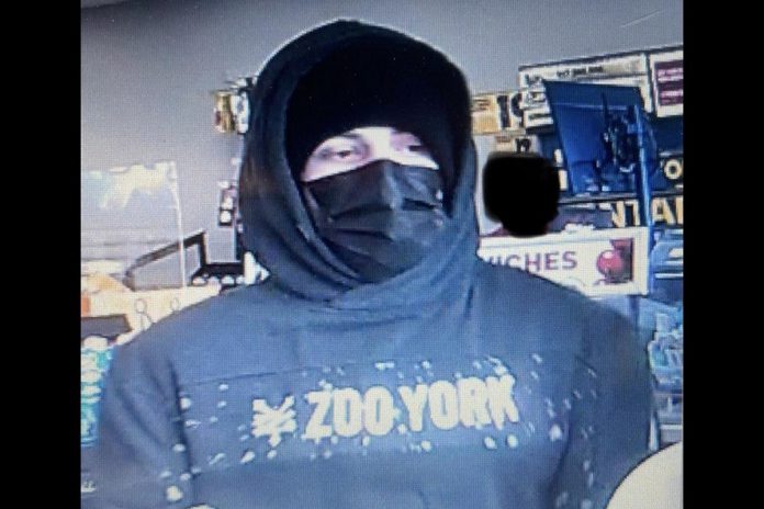 The lone male suspect in the robbery of a convenience store on William Street North in Lindsay on April 20, 2022. (Police-supplied photo)