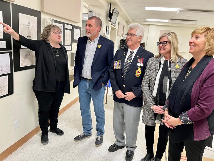 Karen Cooper of the Omemee Legion talks about the Legion's exterior renovation plans with Kawartha Lakes Mayor Andy Letham, Legion President Bill McQuade, Deputy Mayor Tracy Richardson, and Haliburton-Kawartha Lakes-Brock Laurie Scott on April 21, 2022. (Photo: Office of Laurie Scott)