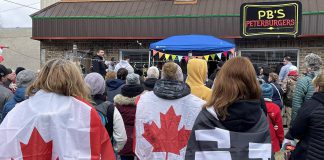Some of the people who gathered at Peterburgers on April 9, 2022 to support the restaurant, which held s grand reopening after having been closed for four months for defying COVID-19 public health measures. (Photo: Caryma S'ad / @CarymaRules Twitter)