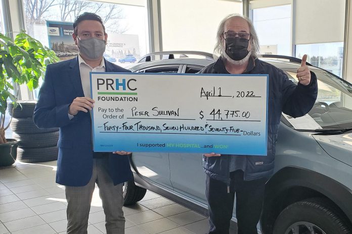 Peterborough Subaru general manager Hernan Lagos (left) presents Peter Sullivan with a ceremonial cheque for $44,775, representing the grand prize jackpot of the PRHC Foundation 50/50 Lottery drawn on April 1, 2022. (Photo courtesy of PRHC Foundation)