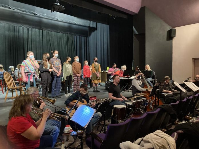 An orchestral ensemble, brought together by musical directors Justin Hiscox and Brian McDonald, rehearses with the cast of "Annie" at the Showplace Performance Centre. The Peterborough Theatre Guild is presenting the much-loved musical after a series of forced postponements during the course of the pandemic. (Photo courtesy of Pat Hooper)
