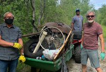 Kawartha Rotarians Gord Fallen, Wesley Letsholo, and Guenther Schubert participating in a clean-up along the Jackson Park trail in 2021. (Photo courtesy of Rotary Club of Peterborough Kawartha)