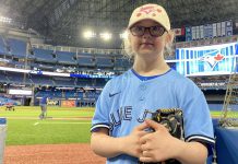 Sarah Patterson, a Grade 4 student with Down Syndrome at St. Anthony Catholic Elementary School in Port Hope, preparing to throw the ceremonial pitch at the Blue Jays game at the Rogers Centre in Toronto on April 25, 2022. Sarah was recognized for her participation in the Jays Care Foundation affiliate school program, which her teacher Allison Jacques ran from February to April. (Photo: Jays Care Foundation / Twitter)